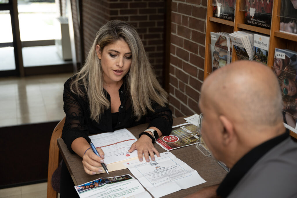 Rezarta Prence helps an individual at the corps.