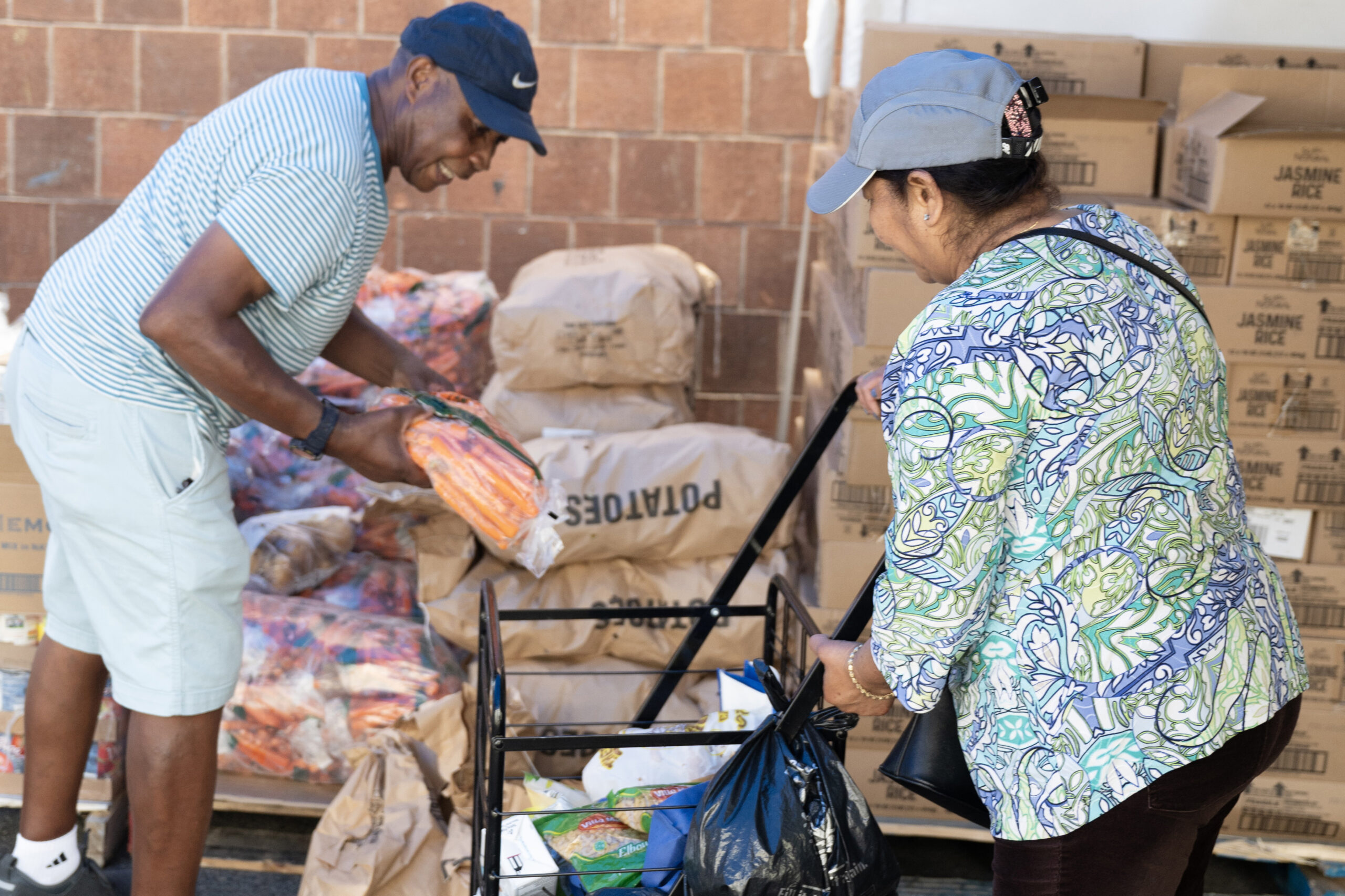 The Chelsea Corps registers people who get help from its food pantry.