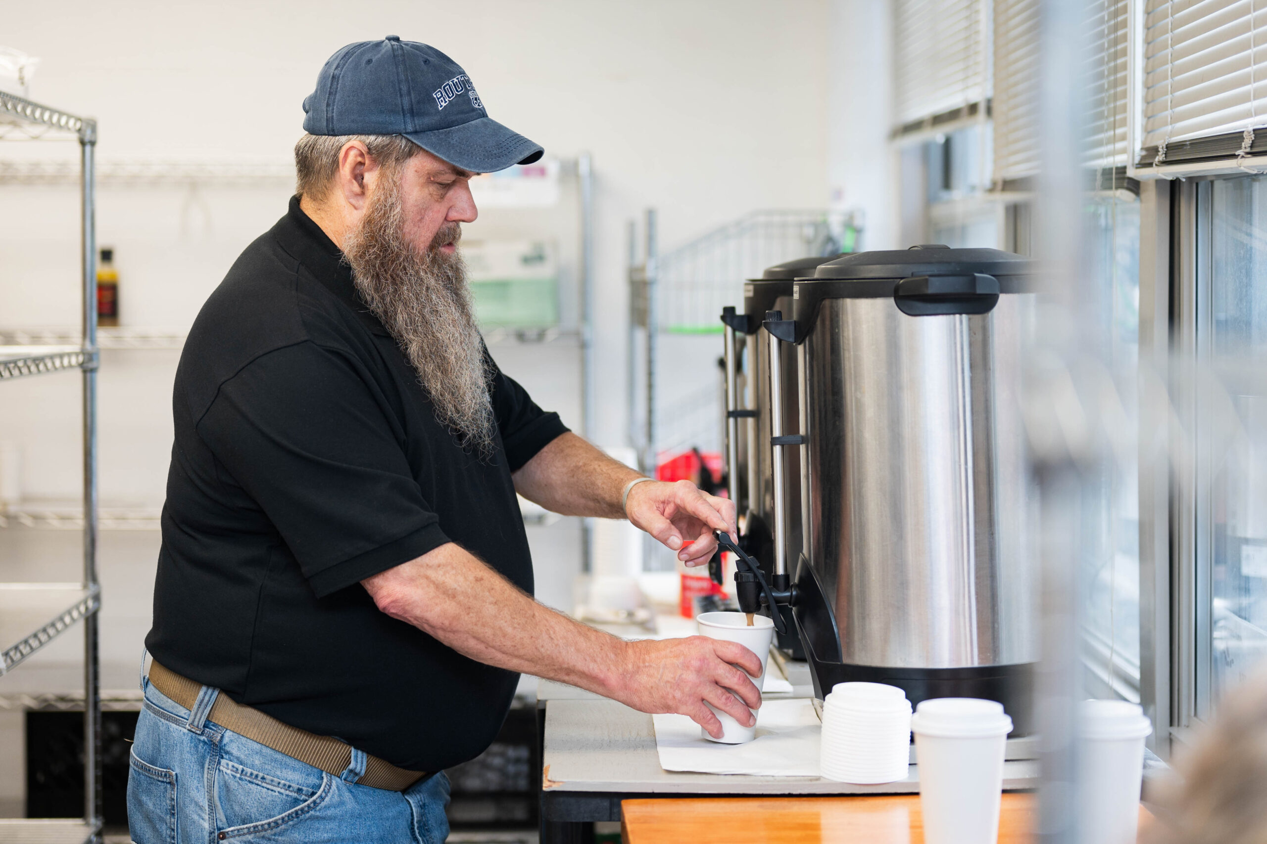 Walt Kehoe prepares coffee for the corps’ morning ministry.