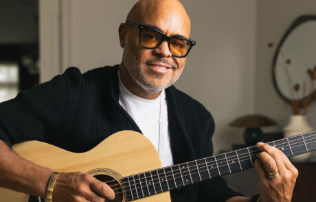 Israel Houghton holding guitar