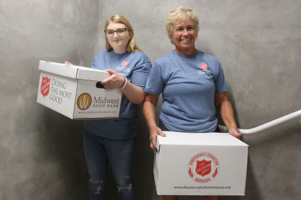  Sydney Blackmore and her mother, Kim Blackmore, are two of the volunteers in Clearwater, Fla., who helped carry 80 food boxes and 60 cases of water up the stairs to residents of a 12-story building